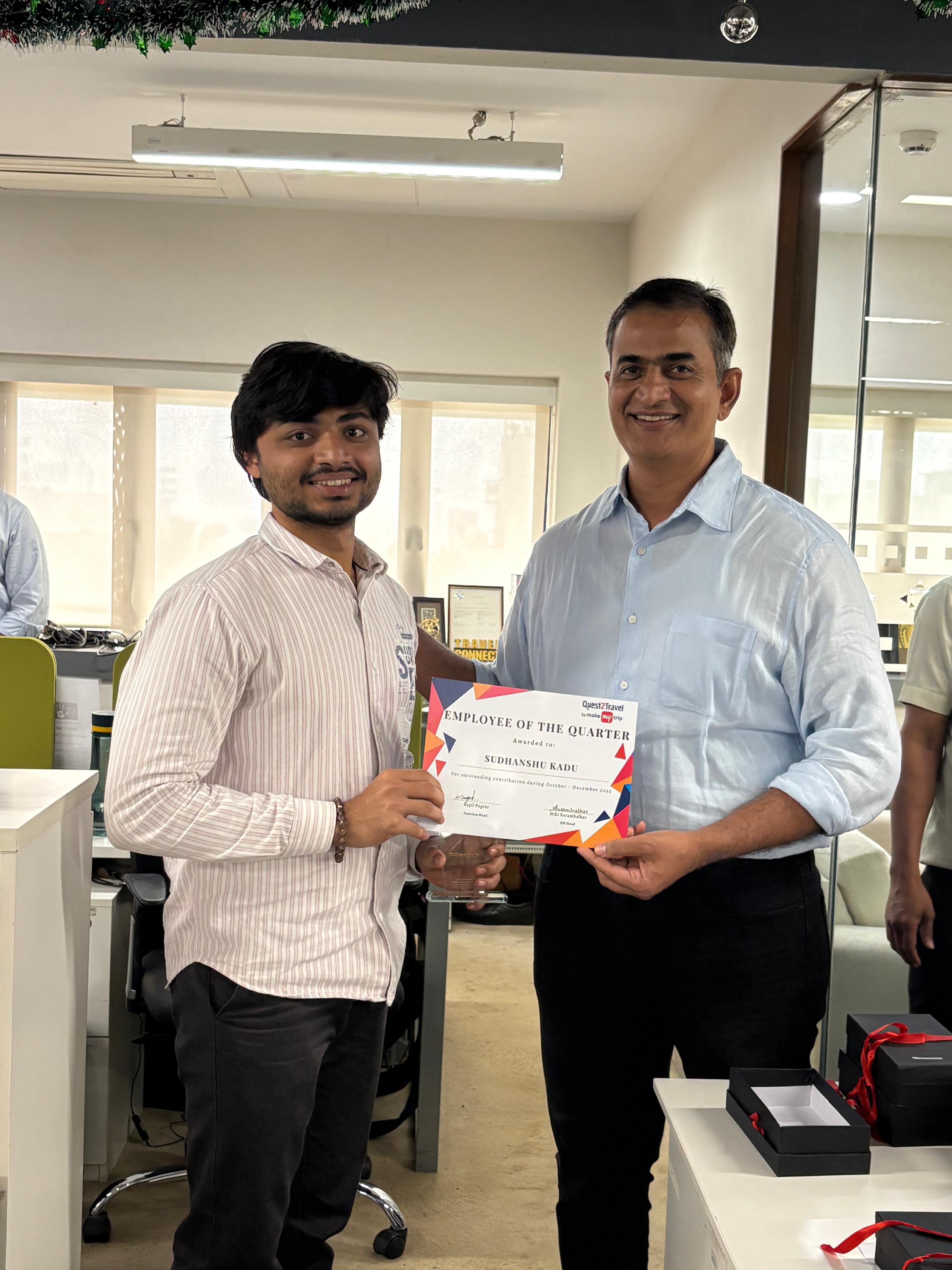 Sudhanshu receiving the Employee of the Quarter certificate at Quest2Travel