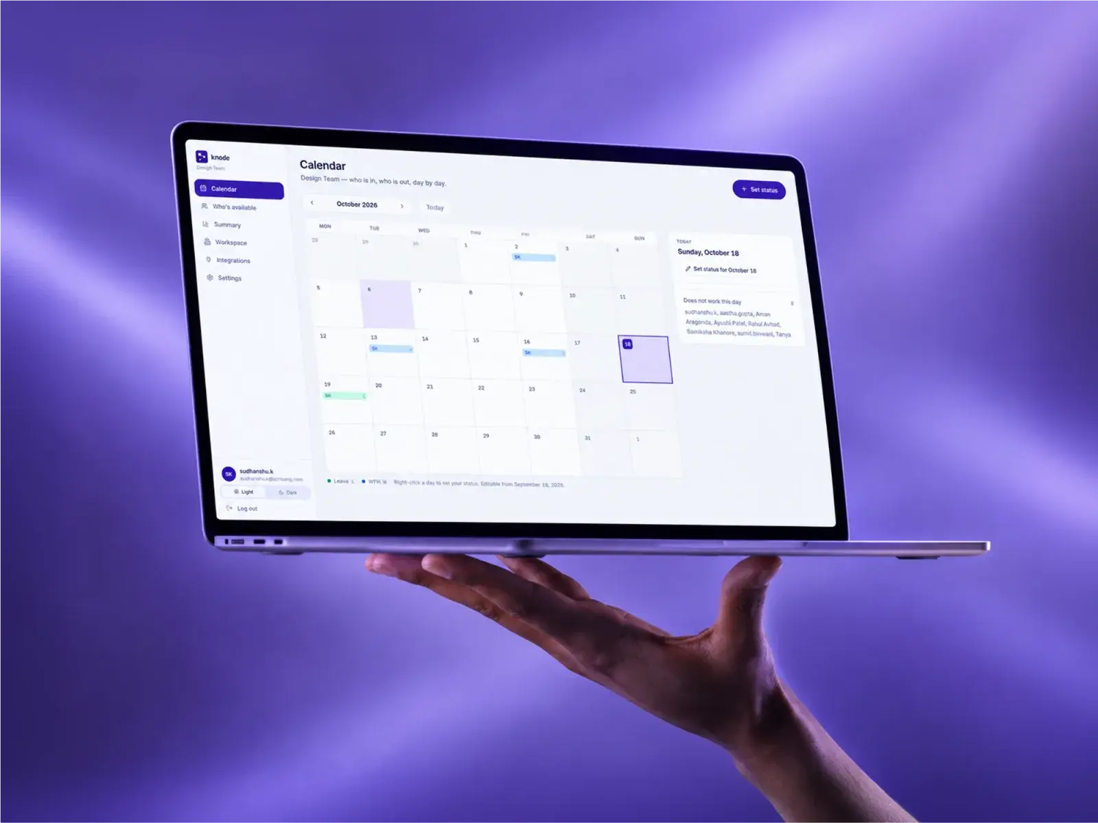 A laptop held up in one hand showing Knode's calendar: October laid out with each person's leave and working from home days on it